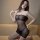 Woman modeling yeqingge transparent lace bodysuit, sheer mesh design with open-crotch and high-waisted thigh-highs.