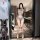 Woman modeling yese yese lace trim mesh bodysuit set with sheer floral cut-out bra and panty in modern bathroom.