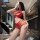 Woman modeling red yese yese lace trim mesh bodysuit set with sheer floral cut-outs, matching bra and panty ensemble.