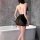 Woman wearing yese yese sensual butterfly lace sleepwear, a vintage-inspired sheer qipao nightgown, posing by a bathtub.