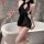 Woman in black sheer qipao nightgown with butterfly lace, holding wine glass by bathtub – yese yese sensual sleepwear.