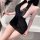 Woman in black sheer lace qipao nightgown with butterfly details, posing by bathtub holding feather fan.