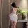Elegant white lace floral bodycon slip dress, perfect evening attire for women.