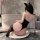 Woman in yesiyesi sexy lace bodysuit with cat ears, posing by bathtub in seductive halter neck lingerie outfit.