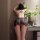 Woman wearing yeyu lace babydoll nightgown, a sexy sheer strap dress with ties, showcasing elegant lingerie design.