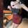 A woman poses wearing a yilele new year lingerie set, featuring a sheer seductive sleep dress with red roses, padded straps, ...