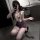 Woman wearing yimengyaoqing sexy lingerie set with deep v-neck, lace detailing, and bodycon skirt in office setting.