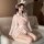 A woman wearing a pink yiyue lingerie set inspired by japanese kimonos, featuring bunny ears and cute patterns, perfect for r...