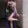 A woman poses elegantly in a sheer lace slip dress featuring a side slit, perfect for seductive sleepwear. the design include...