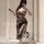 A woman poses in a sheer lace nightgown with high slits, featuring underwire push-up support, capturing an elegant and sensua...