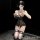 Woman wearing yue feng qing lingerie set with lace push-up top and sheer open-crotch design, posing in a dimly lit room.