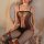 Woman wearing yuedie sexy lace bodystocking with garter straps, sheer mesh open-crotch design, red trim details.