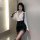 A stylish yujie-style secretary outfit featuring a sheer white blouse paired with a black mini skirt, perfect for a chic offi...