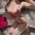 Woman wearing zeyou sexy nurse costume set – red lace trim bodysuit with heart & bow, sheer mesh top, matching nurse hat, kne...