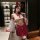 Woman modeling zhongqu sexy chinese-style lingerie set with sheer top, red bow accents, and satin skirt for alluring role pla...