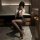 A woman poses confidently in a sleek bathroom, wearing a stylish zimei sexy nightwear set. the outfit features a form-fitting...