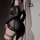 Sexy lace bodysuit dress featuring sheer mesh fabric, strappy details, and cut-out design for a bold look.