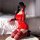 A woman poses in a red ziqu sexy velvet bodycon dress with lace trim, perfect for holiday-themed lingerie and sleepwear.