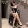 Woman modeling feimou french romantic lace leopard sheer dress, sexy backless flirty lingerie zy37, with black heels.