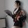 A woman poses elegantly in a black japanese anime-themed sheer kimono-inspired sleepwear set, featuring floral patterns and c...