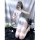 A woman poses with a smartphone, wearing a delicate lace lingerie set paired with fishnet stockings. the outfit features a so...