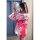 A woman wears a pink floral japanese kimono dress with a large red bow, holding a decorative fan. the outfit features elegant...