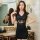 A woman wearing a black transparent lace nightgown, featuring sheer floral patterns, tight-fitting design, and puff sleeves, ...
